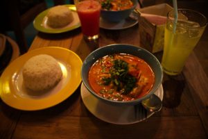 Tom Yum Goong - tomatoey shrimp soup. As well recommended as it is spicy - VERY.